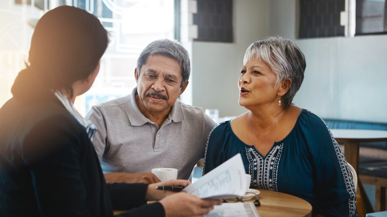 Senior couple meets with advisor.