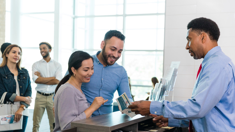 Couple getting information from a banker