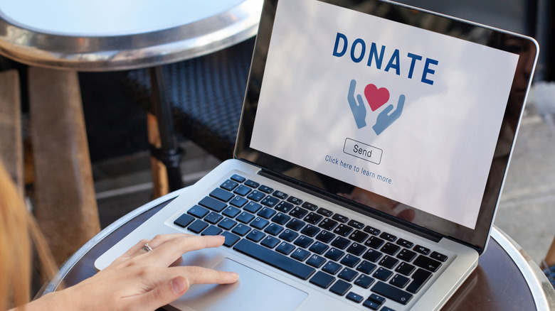 Laptop screen with image of charity donation on screen