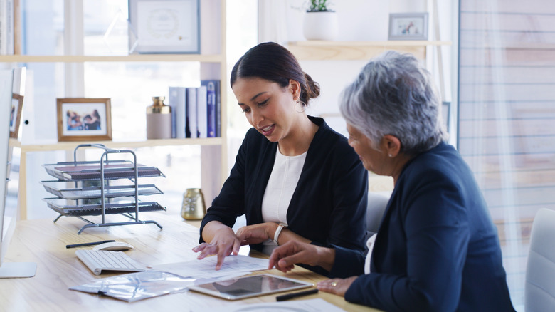 Senior woman meeting with female attorney