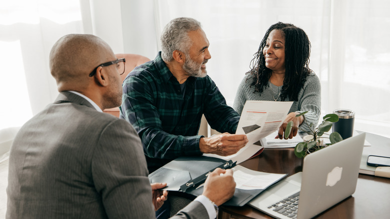 An older couple going over their finances with an estate planner