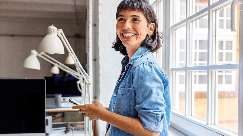 Person by window smiling