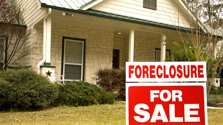"Foreclosure FOR SALE" house sign