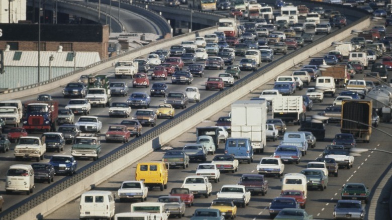 A busy highway in southern California showing multiple lines packed with cars.