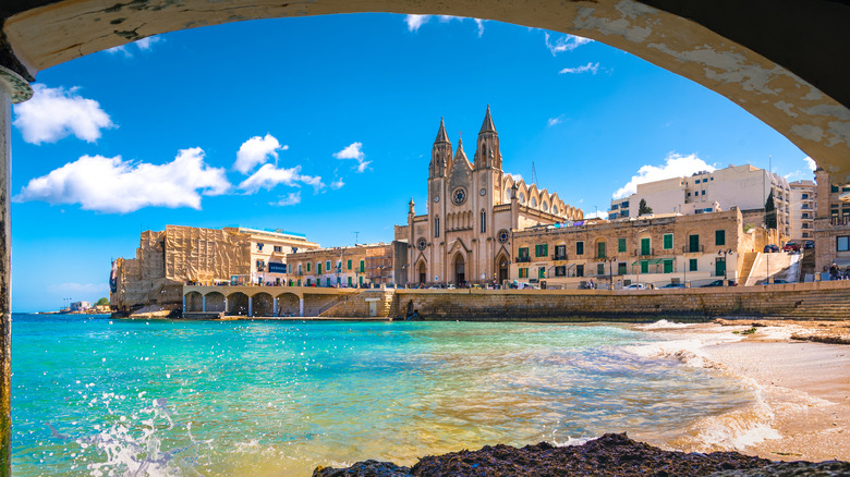 Image of Malta port and beach as seen from under an old bridge
