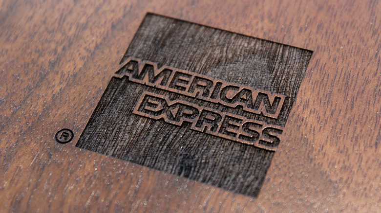 American Express logo embossed in wood