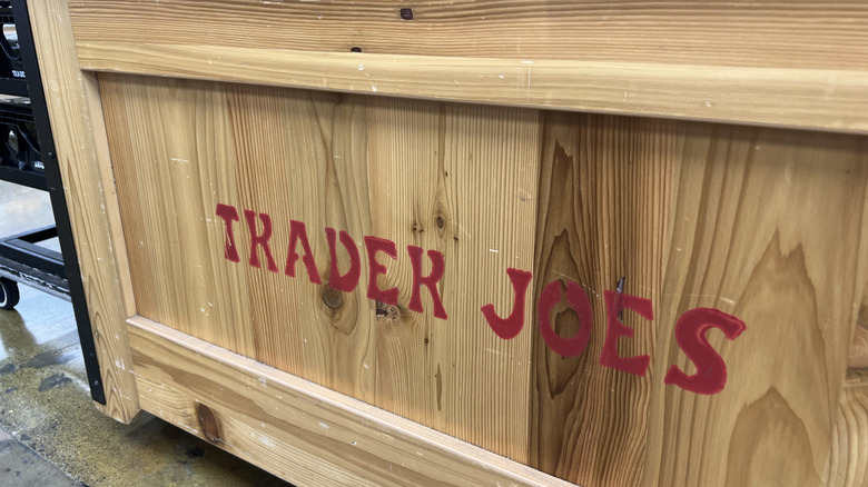 wooden display crate with Trader Joe's logo printed on side