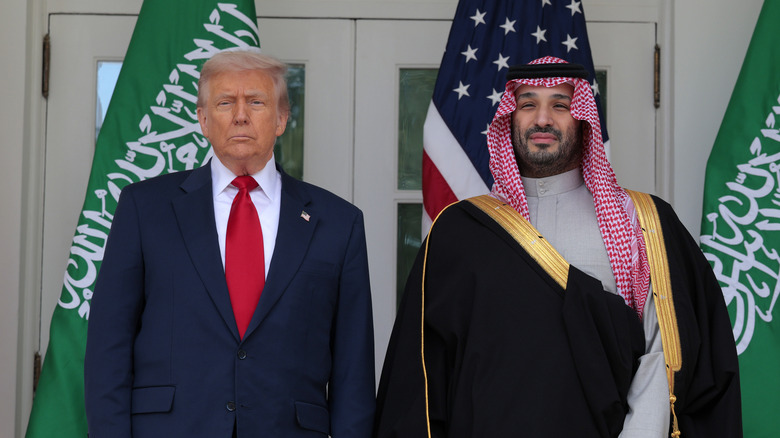 President Donald Trump stands beside Crown Prince of Saudi Arabia Mohammed bin Salman