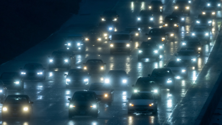 The glow of heavy traffic on a busy roadway at night