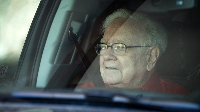 Warren Buffett waits in a car