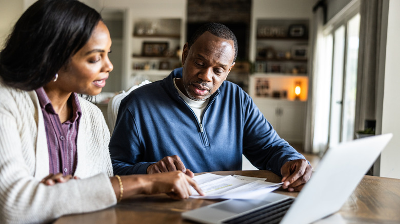 Two people looking over documents