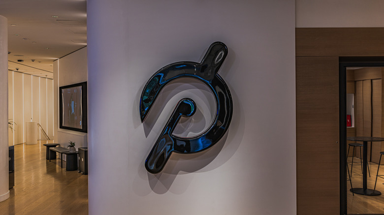 Peloton logo on the wall of an office.