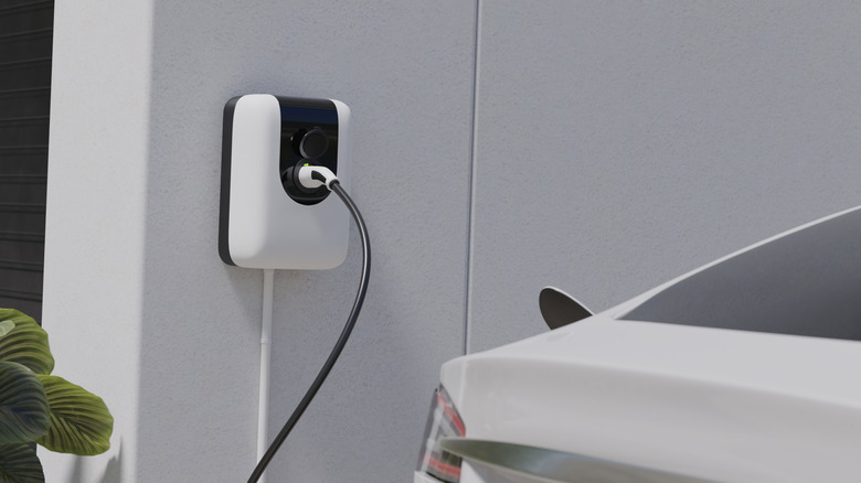 An EV charging cable plugged into a car