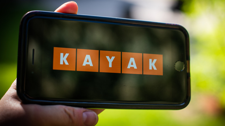 Smartphone displaying Kayak app