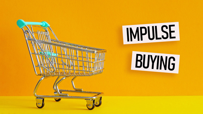 "Impulse buying" signs next to a shopping cart