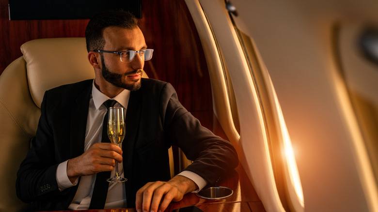 man sitting in a luxury airplane seat