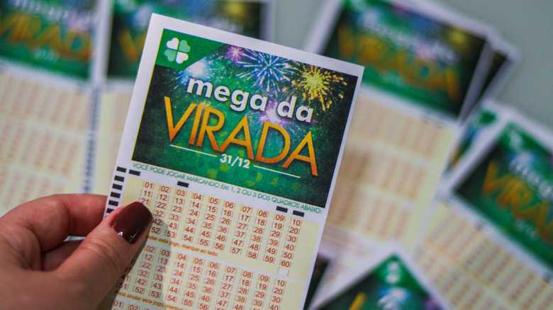 a lottery ticket in player's hand