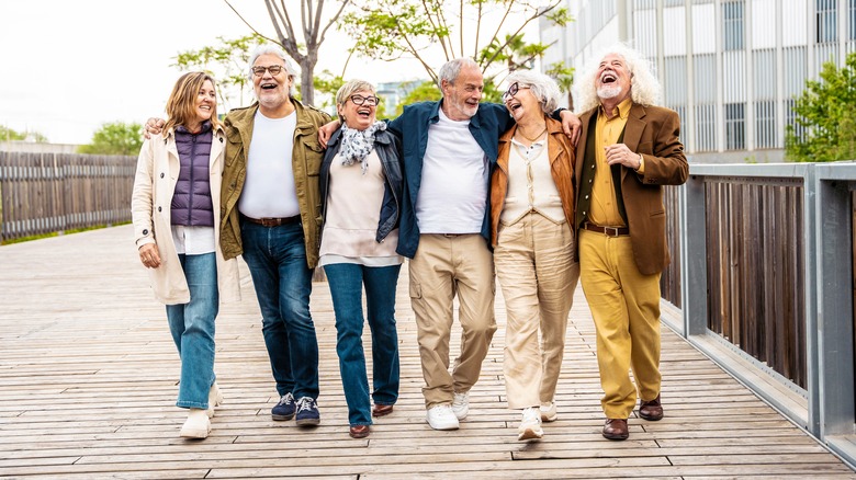 a group of elderly people laugh together
