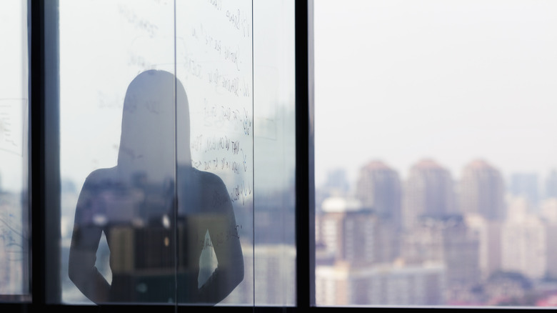 A woman looking out a window