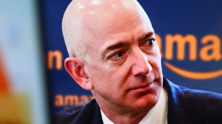 Bald Jeff Bezos looking to his left