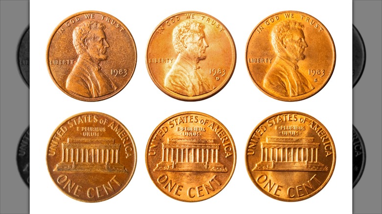 Three 1983 pennies front and back. One has no mint mark.