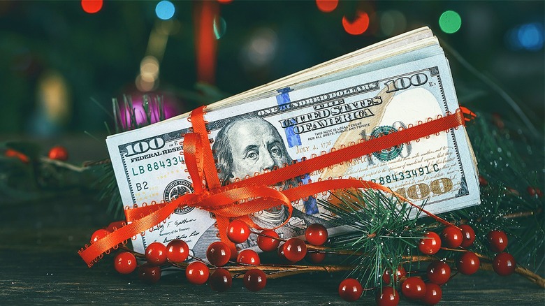 $100 bills wrapped in ribbon