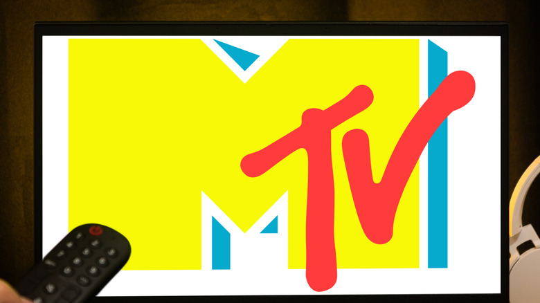 Colorful MTV logo on screen with remote