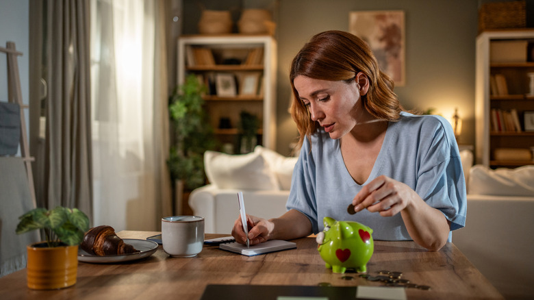 young woman saving money