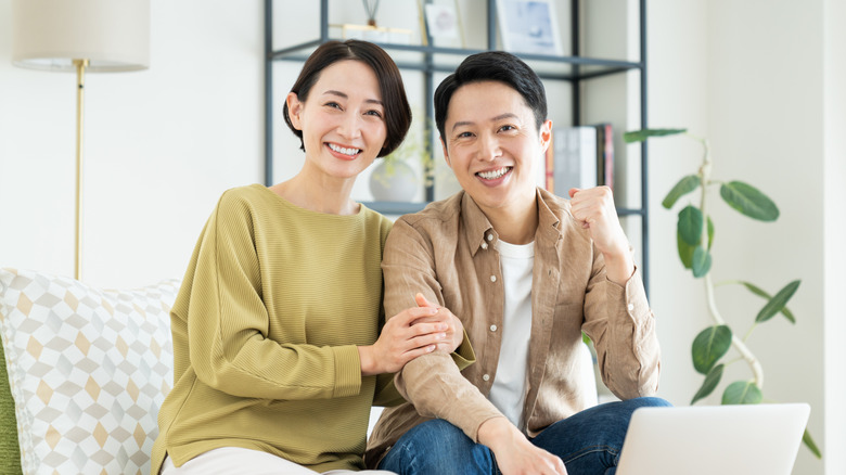 A smiling middle-aged couple