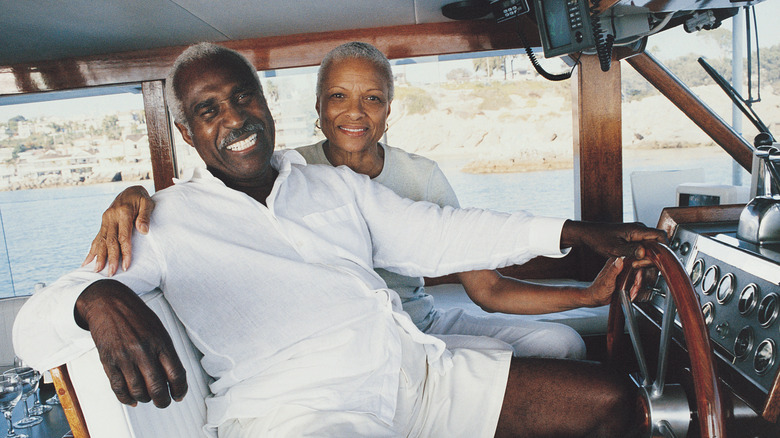 A wealthy older couple on a boat.