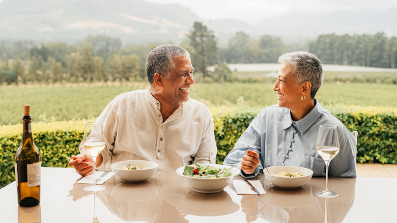 A senior couple enjoying an alfresco meal