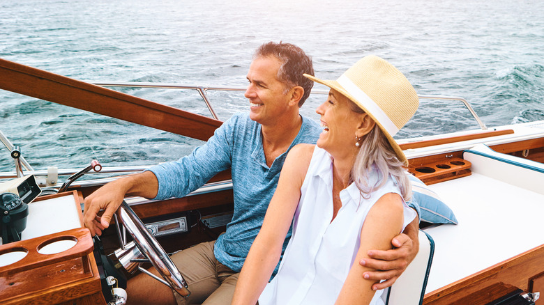 wealthy couple in boat.