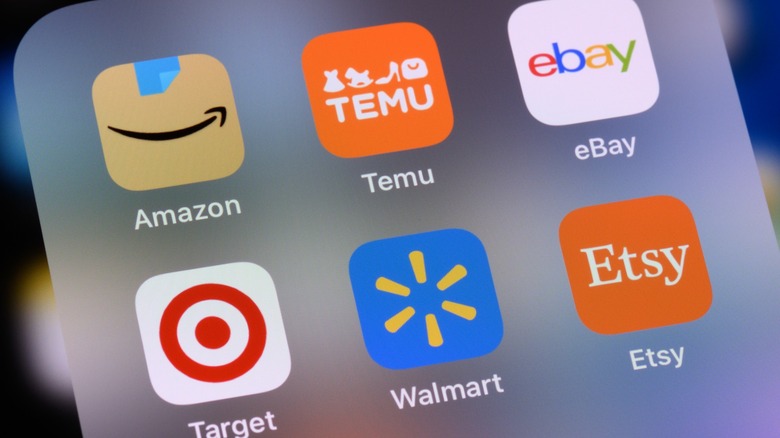 An iPhone app folder with shopping apps in it
