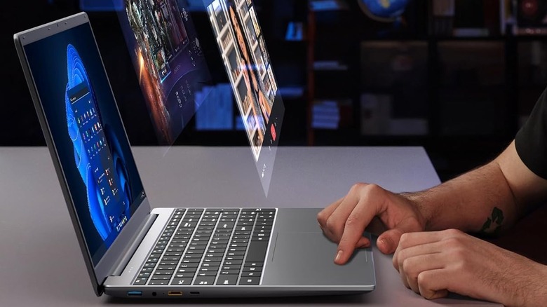 a man scrolling on a Jumper laptop