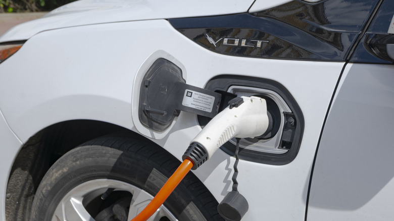 A second-generation Chevrolet Volt plugged into a public charging station.