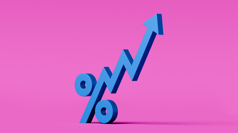 A percentage symbol with a rising ticker