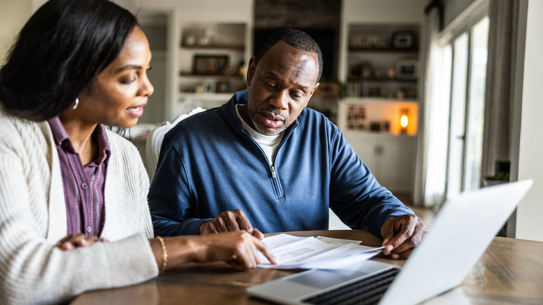 husband and wife consider their personal finance options