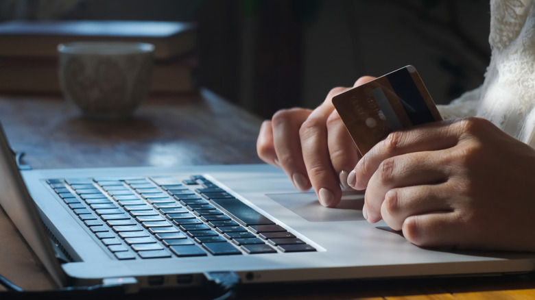 making a credit card payment on laptop