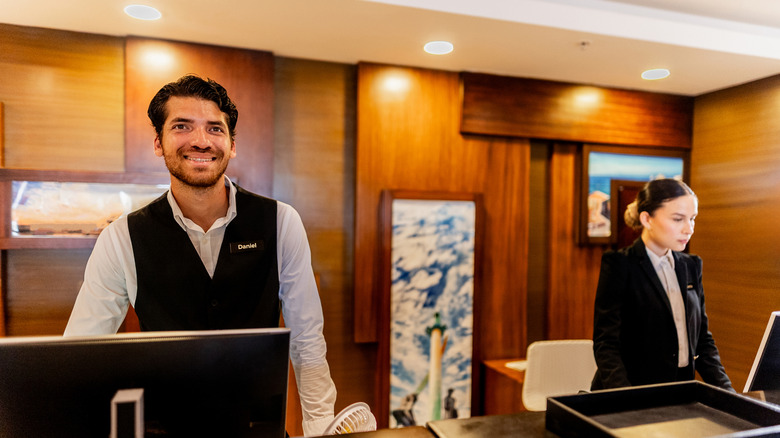 Portrait of young receptionist at hotel.