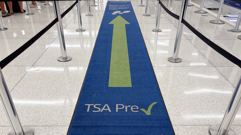 A carpet at Orlando International Airport points in the direction of a TSA Precheck security checkpoint run by the Department of Homeland Security.