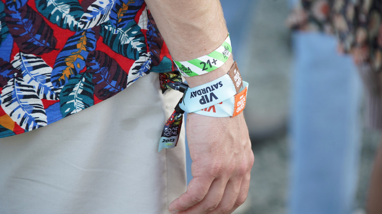 A concert goer wears a VIP wristband at the 2023 Sound on Sound Music Festival.