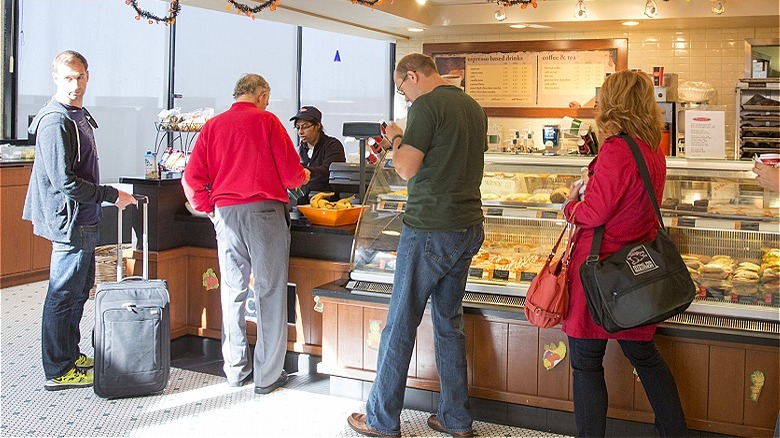 Travelers at airport sandwich shop