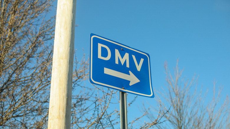 DMV sign street showing where to get drivers registration